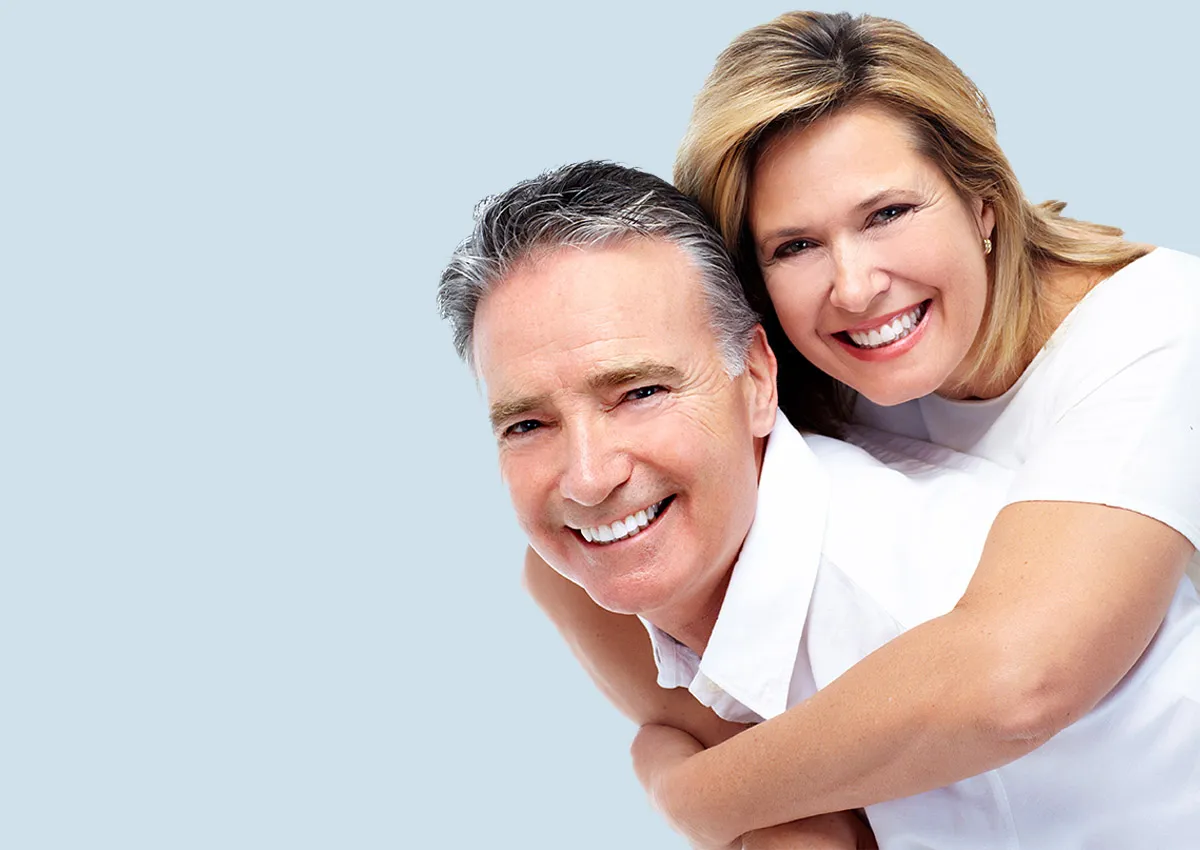 An older couple with dental crowns 