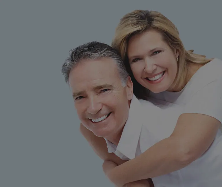 An older couple with dental crowns